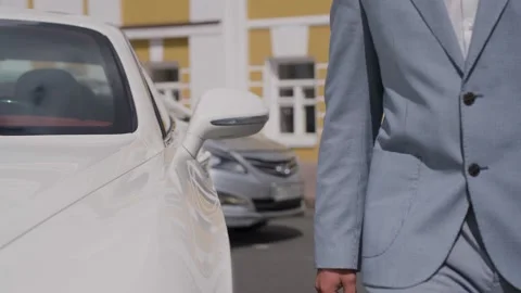 A man in a jacket gets out of a car Stock Footage 329095466