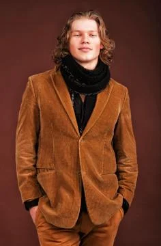 Man in  jacket  isolated on brown background Stock Photos