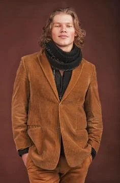 Man in  jacket  isolated on brown background Stock Photos