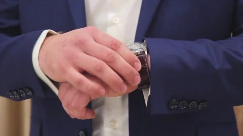 A man in a jacket on a light background, a groom's fees Stock Footage