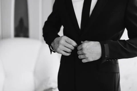 A man in a jacket on a light background, a groom's fees, black and white Stock Photos