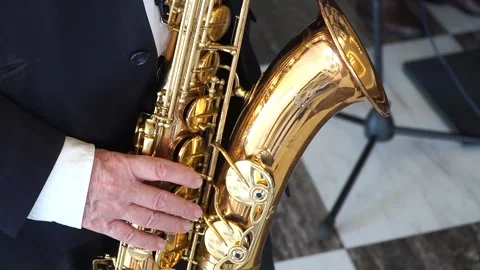 Man in jacket playing saxophone Stock Footage 270125346