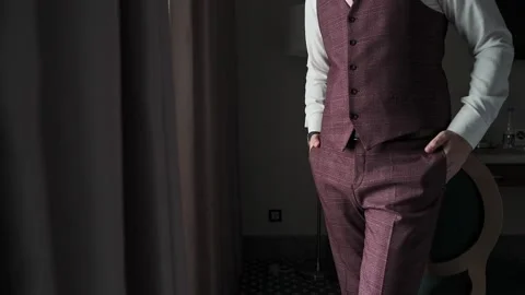 A man in a jacket puts his hand in his pocket Stock Footage 328299468