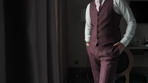 A man in a jacket puts his hand in his pocket Stock Footage 328299487