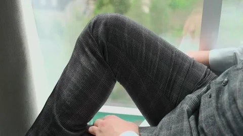 A man in a jacket sits by the window Video stock 328183702