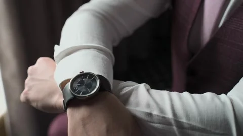 A man in a jacket sits by the window Stock Footage 328299470