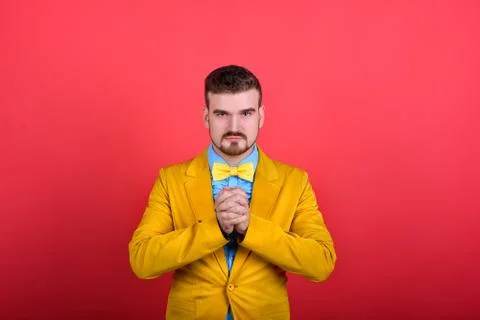Man in jacket squeeze his hands into a fist Stock Photos