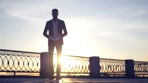 A man in a jacket throws papers up. separated from debts. HD, 1920x1080, slow Stock Footage 114601426