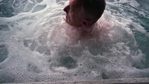 Man in a jacuzzi pool. Stock Footage 311245373