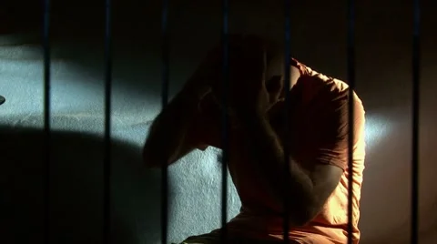 Man in jail, prison bars (take 2) - front right Video stock 7758528