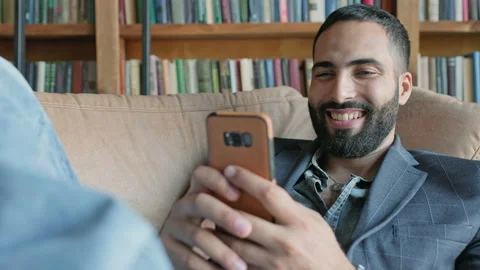 Man In Jeans And Jacket Sitting On The Couch. Vídeos de archivo 140223968