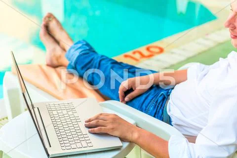 Man in jeans and a white shirt works Stock Photos