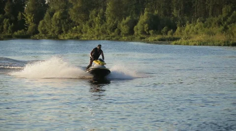 Man on jet ski in a river Stock Footage 65303737