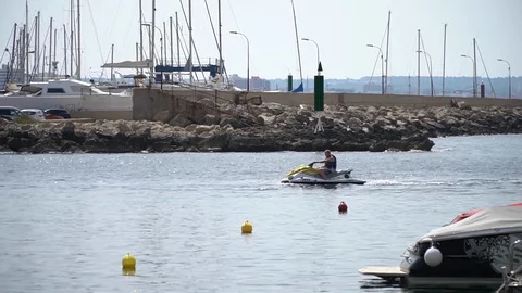 Man on jet ski slow Stock Footage 128348347