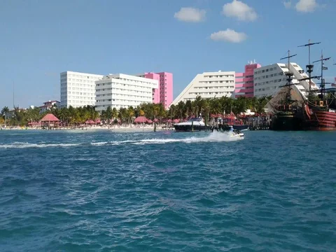 Man on Jet Ski Speeding Through Hotel Zone Stock Footage 73975057