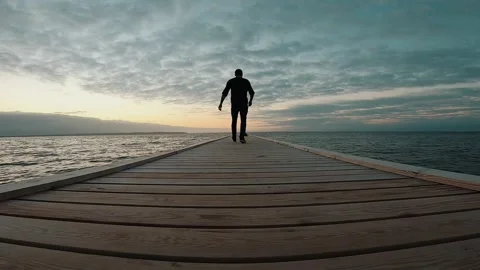 Man on jetty Stock Footage 163313976