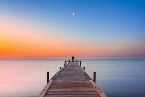 Man on the jetty Stock Photos