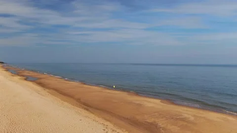 A man jogging along sandy beach. Stock Footage 155307753