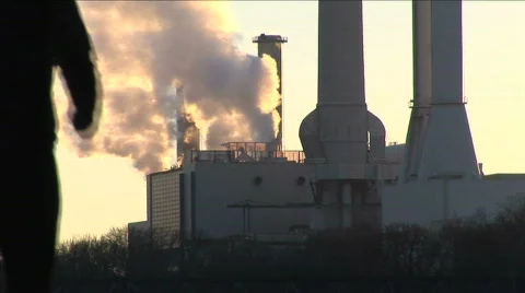 Man jogging around factory Stock Footage 277573