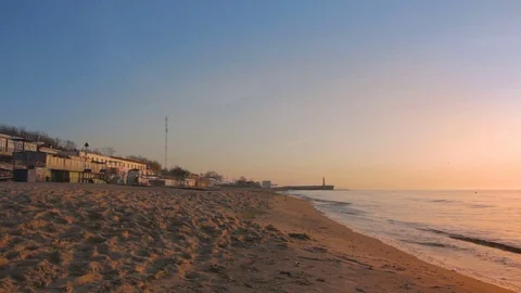 Man jogging on the beach during sunset at the sea shore Stock Footage 75320392