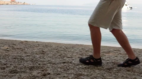 A man is Jogging on the beach Stock Footage 97923995