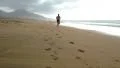 Man jogging on the beach - front view HD Footage