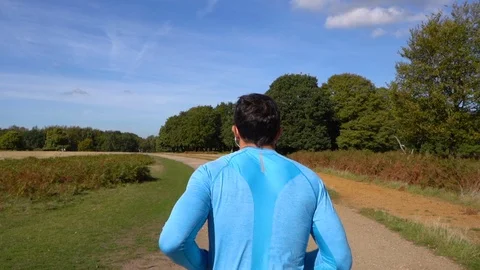 Man Jogging from Behind in Slow Motion Stock Footage 96047479