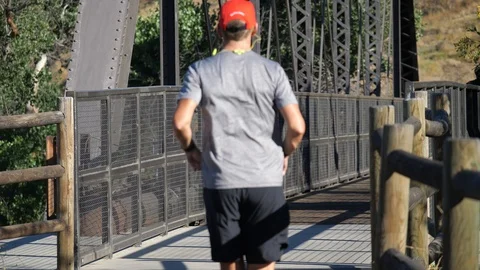 Man Jogging On The Bridge In The City Stock Footage 112898296