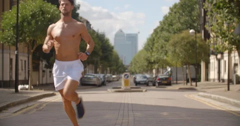 Man Jogging in City. Vídeo Stock 68120765