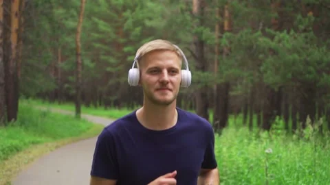 Man jogging with headphones. Stock Footage 221399037