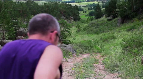 Man Jogging in The Mountain Valley Stock Footage 45890627
