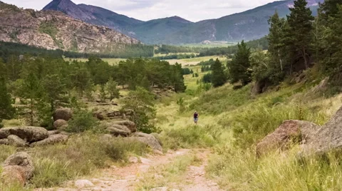 Man Jogging on the Mountain Valley Stock Footage 48848022