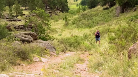 Man Jogging on the Mountain Valley Stock Footage 48848026
