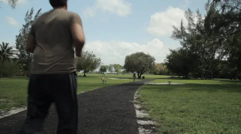 Man jogging in park Video stock 38544934