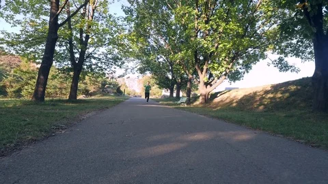 Man jogging in park Stock Footage 82062971