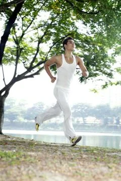 Man jogging in the park Stock Photos