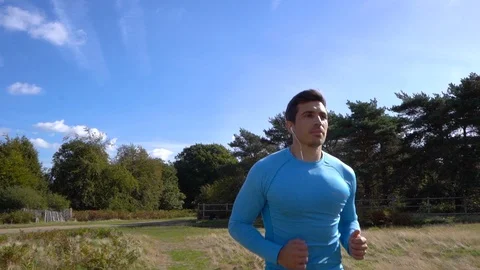 Man Jogging in Park, Slow Motion Stock Footage 96047146