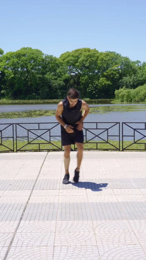 Man jogging in place to warm up for a workout Video stock 316846482