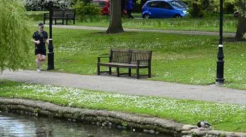 Man Jogging on a riverside path Stock Footage 11062170