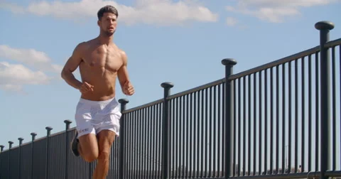 Man Jogging Shirtless on Warm Summers Day. Vídeos de archivo 68117575