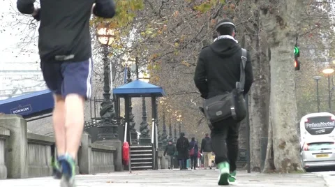 Man jogging on sidewalk in London Stock Footage 45532263