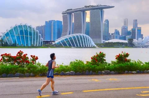 Man jogging in Singapore bay Stock Photos