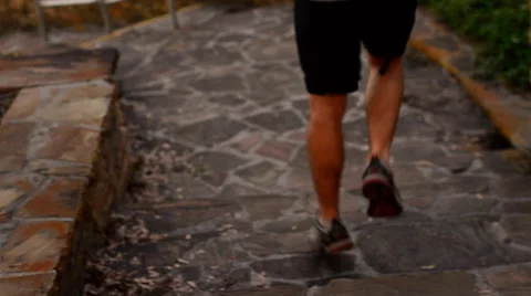 Man Jogging at Sunset on Stone Steps Stock Footage 40596357
