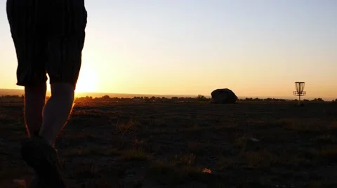Man jogging towards the sunset. Stock Footage 54513446