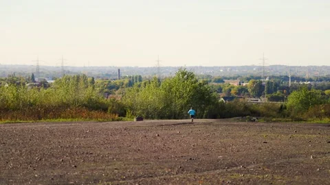 A man is jogging, view from behind Stock Footage 226249307