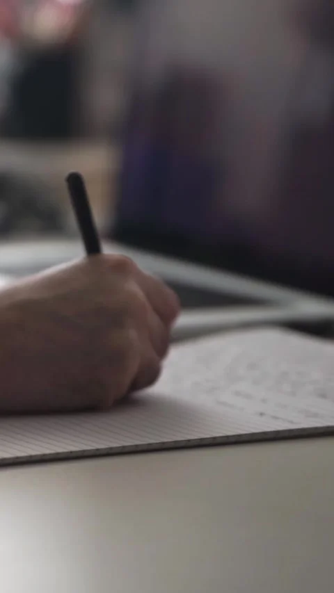 Man journaling thoughts into notebook Stock Footage 293073379