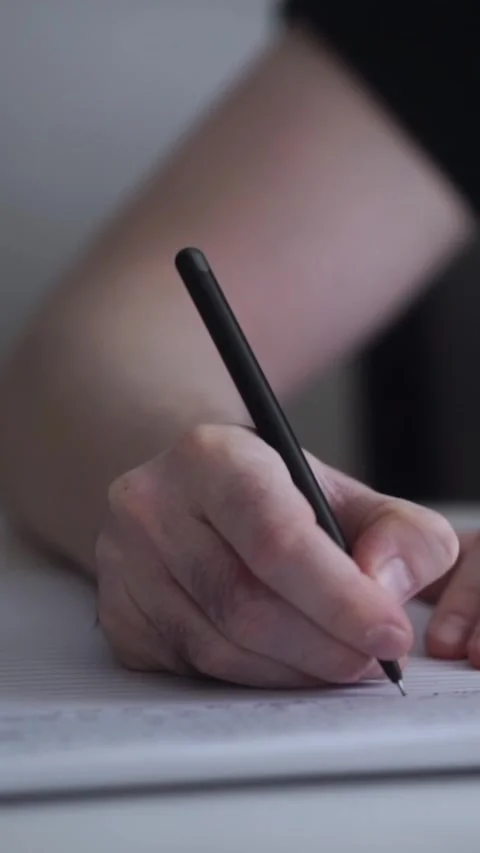 Man journaling thoughts into notebook Video stock 293073412