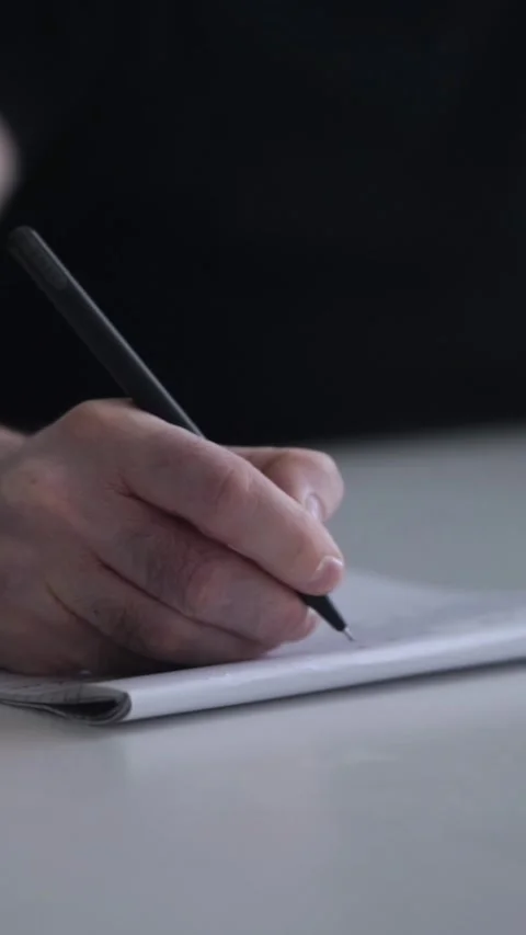 Man journaling thoughts into notebook 스톡 동영상 304083477