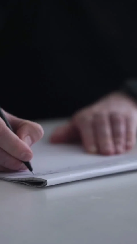 Man journaling thoughts into notebook Stock-Footage 304083516