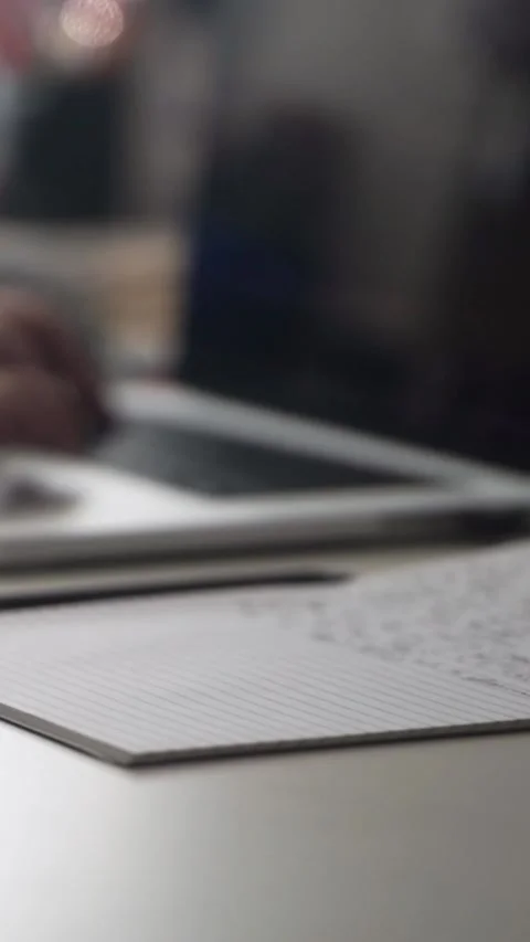 Man journaling thoughts into notebook Stockbeeldmateriaal 304091246